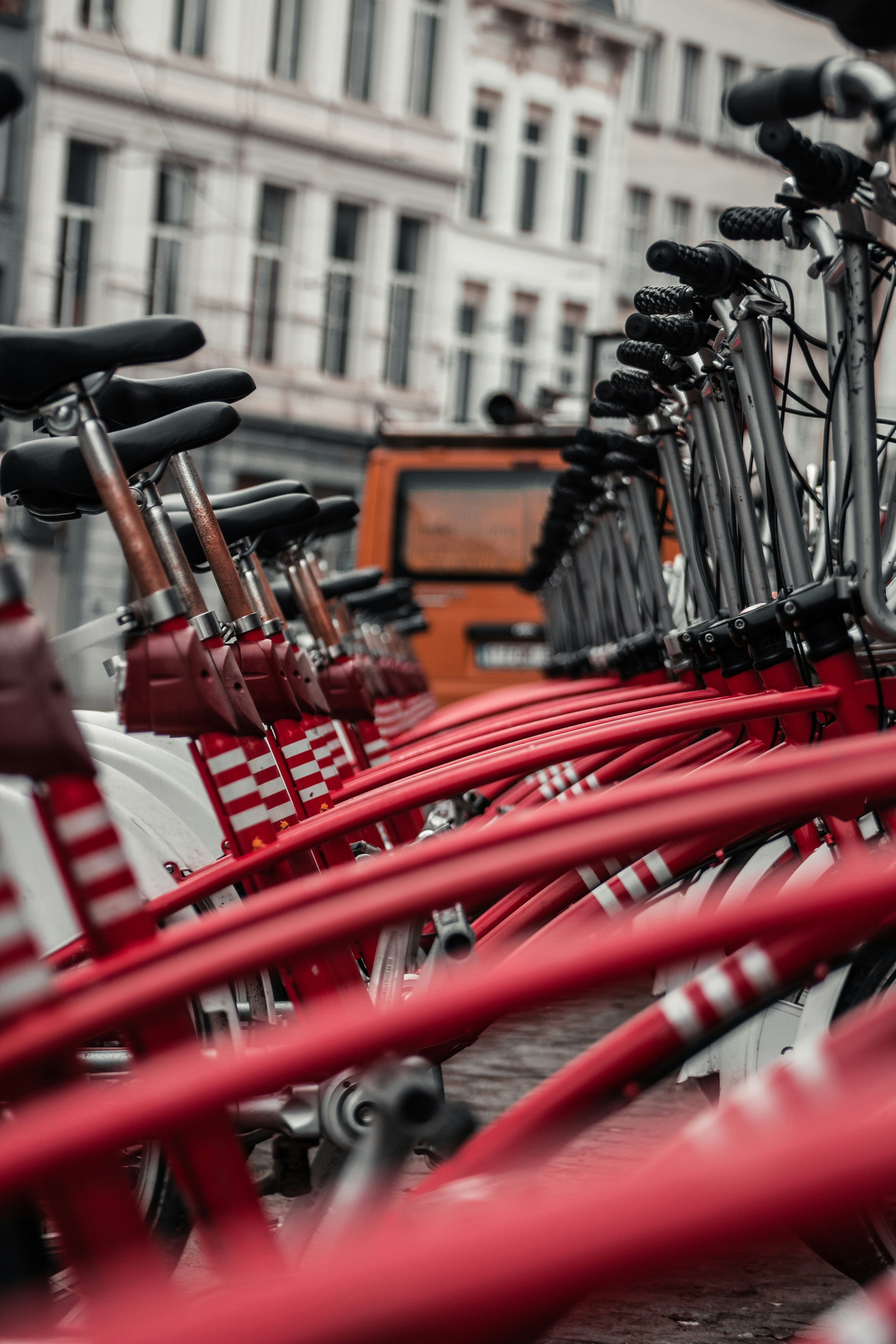 red bicycle parked on the street